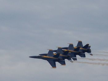 Airplane flying against sky