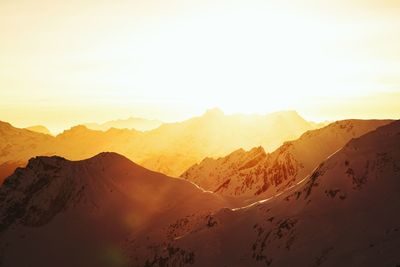 Scenic view of mountains against clear sky during sunset