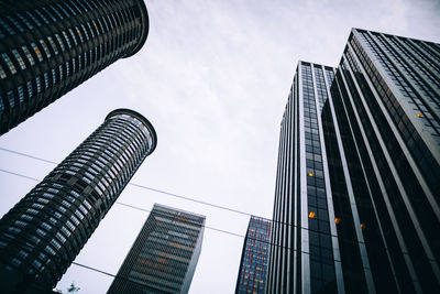 Low angle view of skyscrapers against sky