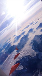 Aerial view of airplane wing against sky