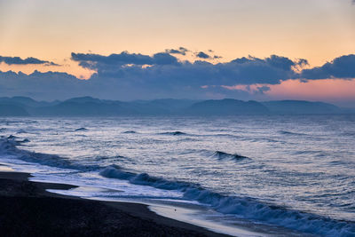 Scenic view of sea against sky during sunrise