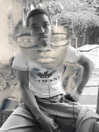 Portrait of young couple sitting outdoors