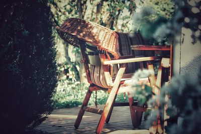 Empty chairs and table in yard