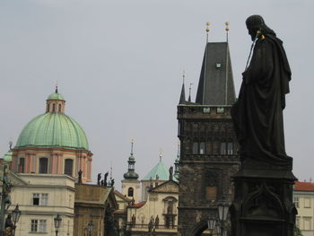 View of statue of buildings against clear sky
