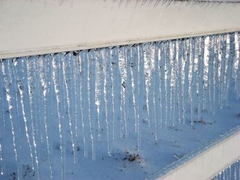 Close-up of snow on window during winter