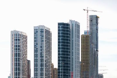 Low angle view of modern buildings against sky