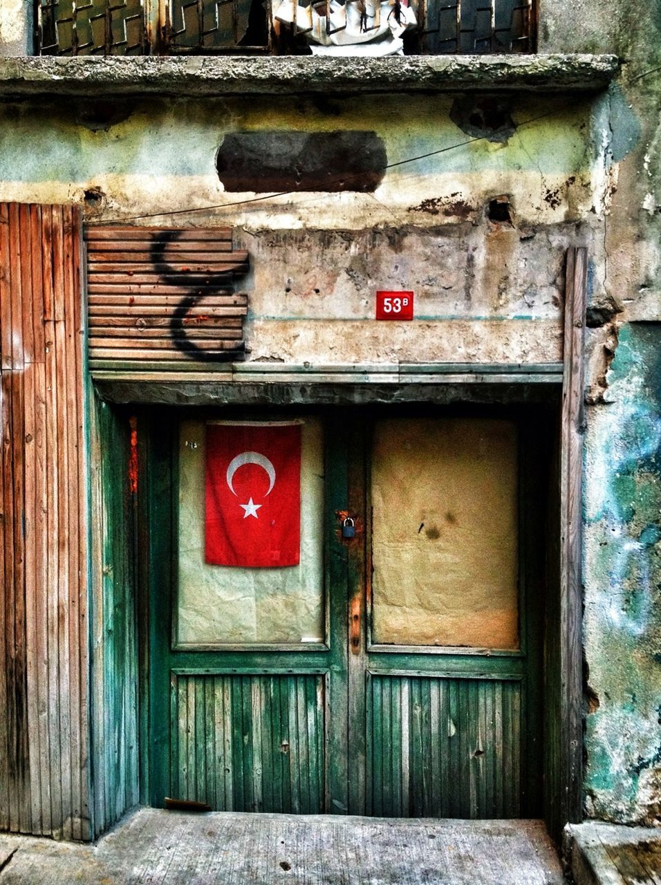 architecture, building exterior, built structure, door, old, wood - material, weathered, text, abandoned, house, red, closed, damaged, window, wall - building feature, communication, obsolete, run-down, western script, deterioration