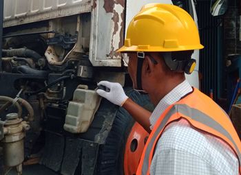 Engineer inspecting truck