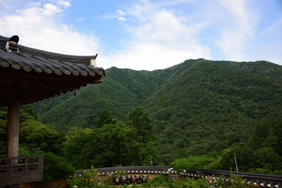 Panoramic view of temple amidst buildings against sky