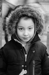 Portrait of boy wearing fur coat