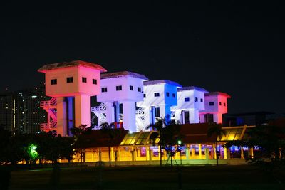 Buildings in city at night