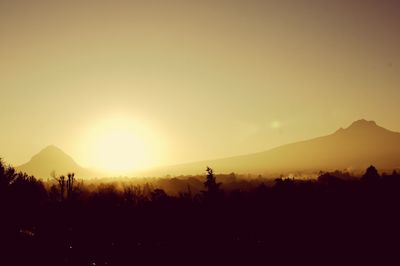 Scenic view of landscape against sky during sunset