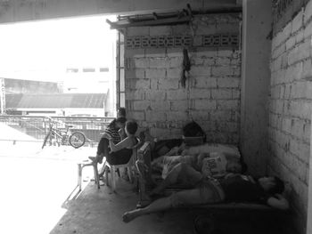 Men sitting in front of building