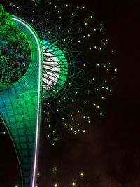 Illuminated ferris wheel at night