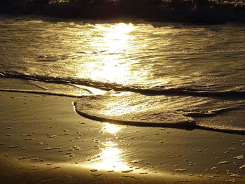 Scenic view of beach against sky during sunset