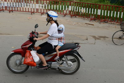 Man riding bicycle on road