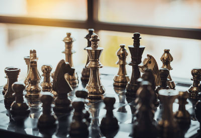 Close-up of chess pieces on table