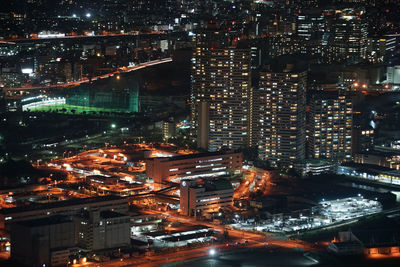 High angle view of illuminated cityscape at night