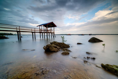 Scenic view of sea against cloudy sky