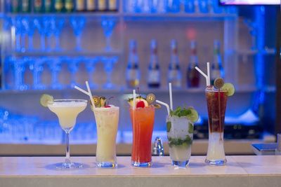 Cocktails on bar counter at night