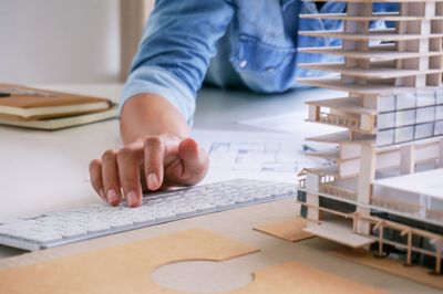 Midsection of man working on table