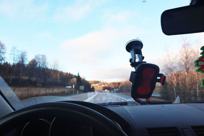 Cars on road seen through car windshield