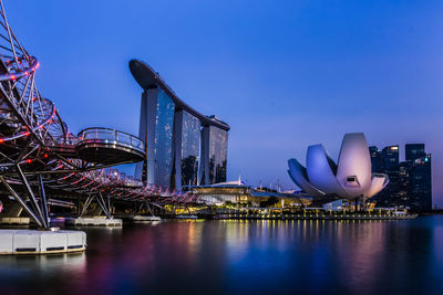 Illuminated city at waterfront