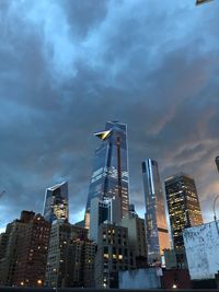 Low angle view of illuminated buildings against sky