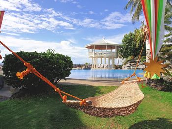 Built structure by sea against sky