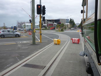 Vehicles on road along buildings