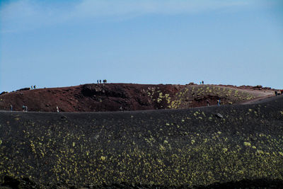 Scenic view of hill against clear sky