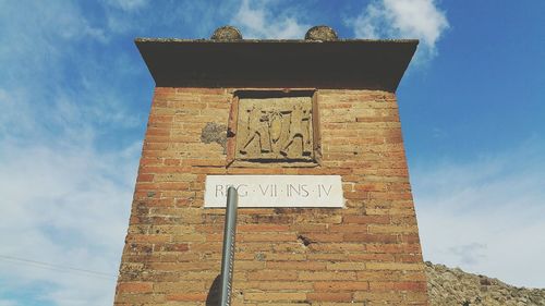 Low angle view of built structure against blue sky