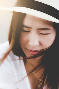 Close-up portrait of a smiling young woman