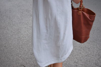 Low section of woman standing outdoors