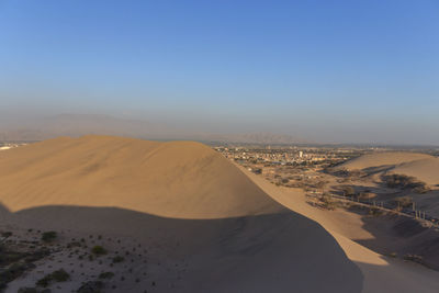 Scenic view of desert against clear sky