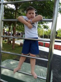 Full length portrait of cute girl on railing