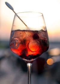 Close-up of drink in glass against sky