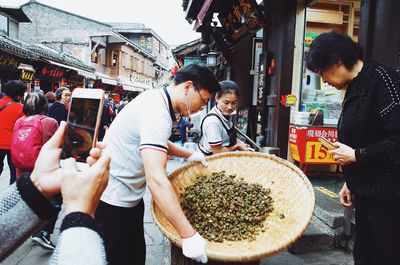 Group of people at market stall