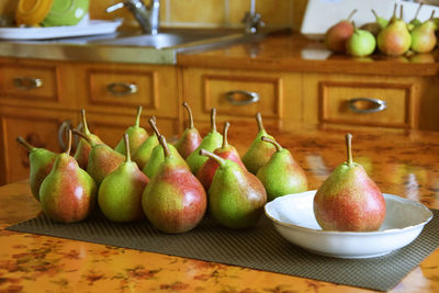 Close-up of apples and fruits on table at home