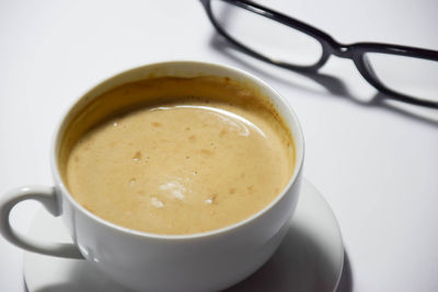 High angle view of coffee cup on table