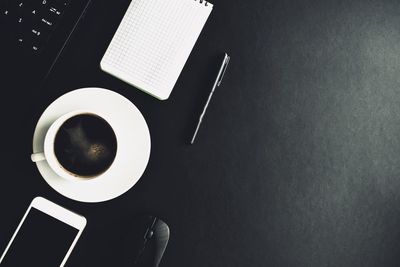 High angle view of coffee cup on table