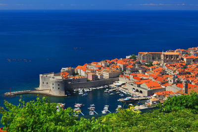 High angle view of town by sea