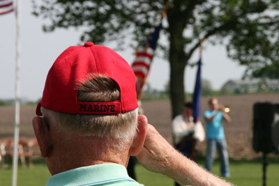 Text on man cap during sunny day