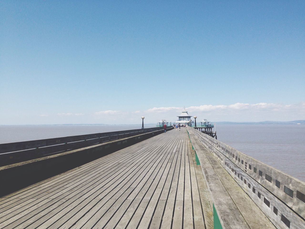 the way forward, sea, diminishing perspective, horizon over water, vanishing point, sky, transportation, blue, water, long, railing, copy space, tranquility, tranquil scene, nature, empty, built structure, road, day, pier