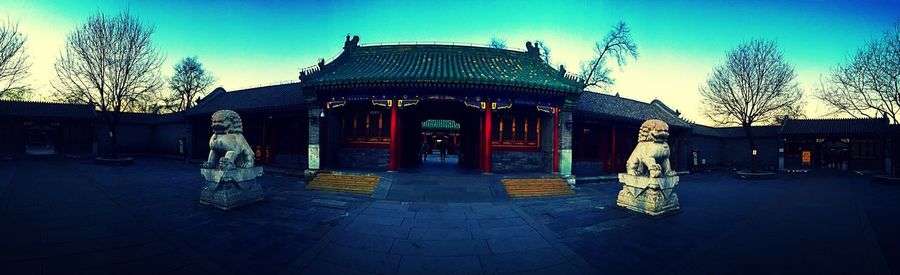 Illuminated temple in front of temple