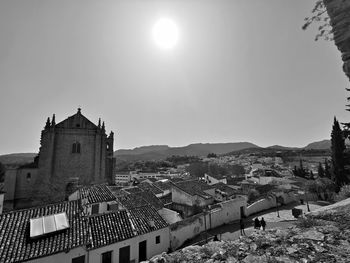 Buildings in city against clear sky