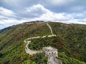 Scenic view of mountain against cloudy sky