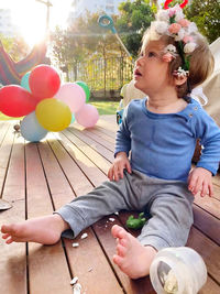 Rear view of a girl looking at balloons