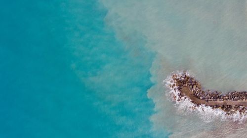 Aerial view of pier in sea