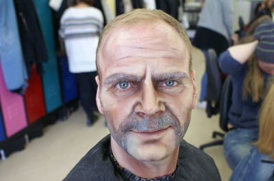 Portrait of mature man with make-up on face at backstage